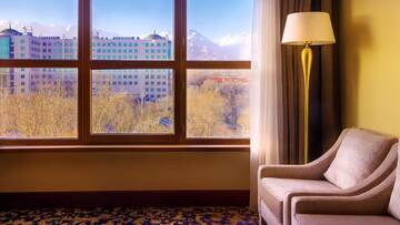 Фото номера Апартаменты с кроватью &quot;king-size&quot; Отель Ramada by Wyndham Almaty г. Алматы 3