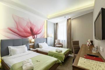 Фото номера Двухместный номер с 2 отдельными кроватями Отель Renion Hills Hotel г. Алматы 3