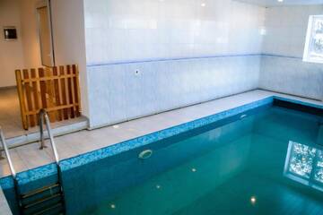 Фото номера Дом с 4 спальнями Дома для отпуска Shymbulak Resort House г. Алматы 42