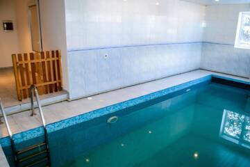 Фото номера Дом с 4 спальнями Дома для отпуска Shymbulak Resort House г. Алматы 10