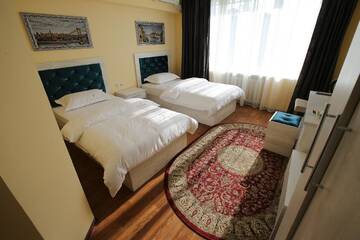 Фото номера Улучшенный двухместный номер с 2 отдельными кроватями Отель Altai Business Hotel г. Алматы 4