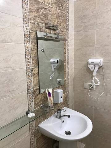 Фото номера Улучшенный номер с кроватью размера «king-size» Отель Altai Business Hotel г. Алматы 11