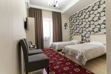 Фото номера Двухместный номер с 2 отдельными кроватями Отель Bastau Hotel г. Алматы 4