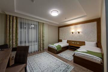 Фото номера Двухместный номер с 2 отдельными кроватями и душем Отель Sacvoyage Hotel г. Алматы 5