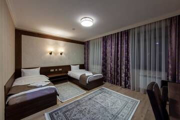 Фото номера Двухместный номер с 2 отдельными кроватями и душем Отель Sacvoyage Hotel г. Алматы 4