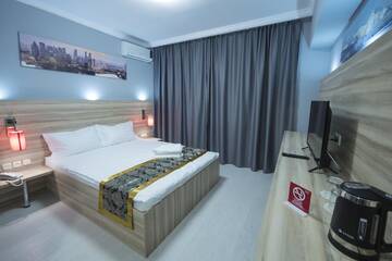Фото номера Двухместный номер Делюкс с 1 кроватью Мини-отель ASIA Hotel г. Алматы 2