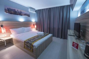 Фото номера Двухместный номер Делюкс с 1 кроватью Мини-отель ASIA Hotel г. Алматы 5