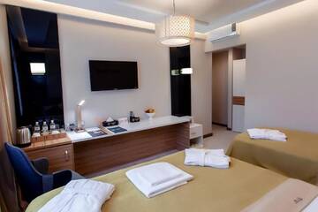 Фото номера Улучшенный семейный номер Отель Mildom Premium Hotel г. Алматы 6