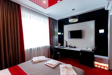 Фото номера Улучшенный двухместный номер с 1 кроватью Отель Mildom Premium Hotel г. Алматы 6