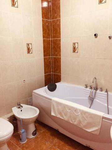 Фото номера Апартаменты с 2 спальнями Апартаменты QonaQ Apartments 414 г. Алматы 48