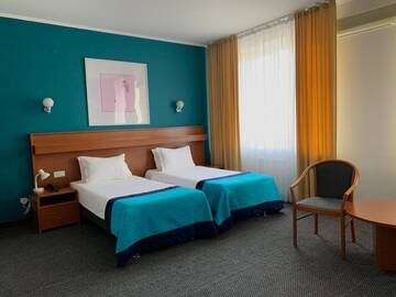Фото номера Двухместный номер Делюкс с 2 отдельными кроватями Отель Mika City Hotel г. Алматы 3