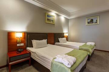 Фото номера Апартаменты с 1 спальней и 2 односпальными кроватями Отель Renion Residence Hotel г. Алматы 8