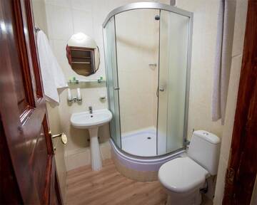 Фото номера Семейный номер с балконом Курортные отели Shymbulak Resort Hotel г. Алматы 4