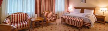 Фото номера Двухместный номер Делюкс с 1 кроватью Отель Grand Tien Shan Hotel г. Алматы 2