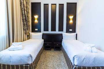Фото номера Стандартный двухместный номер с 2 отдельными кроватями Отель Royal Park Hotel г. Алматы 5